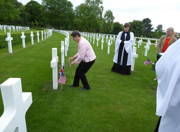 Suzanne places tribute at Howard Schwegel's grave